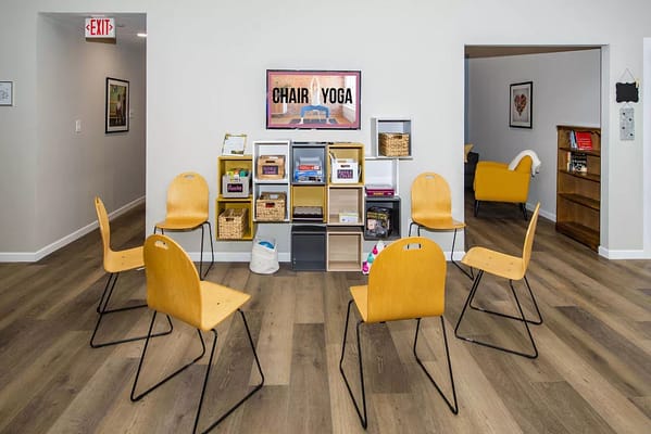 Bright activity room set up for chair yoga