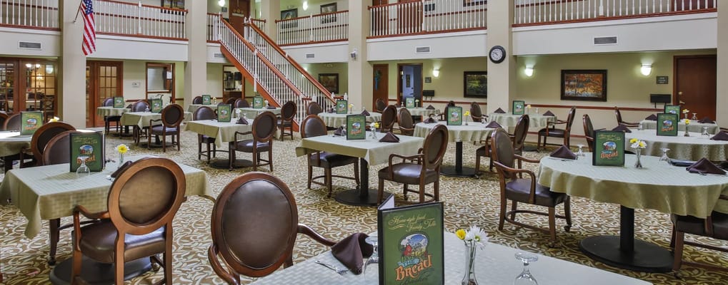 Dining area with tables set for residents