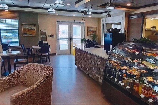 Cozy cafe area with food display and seating