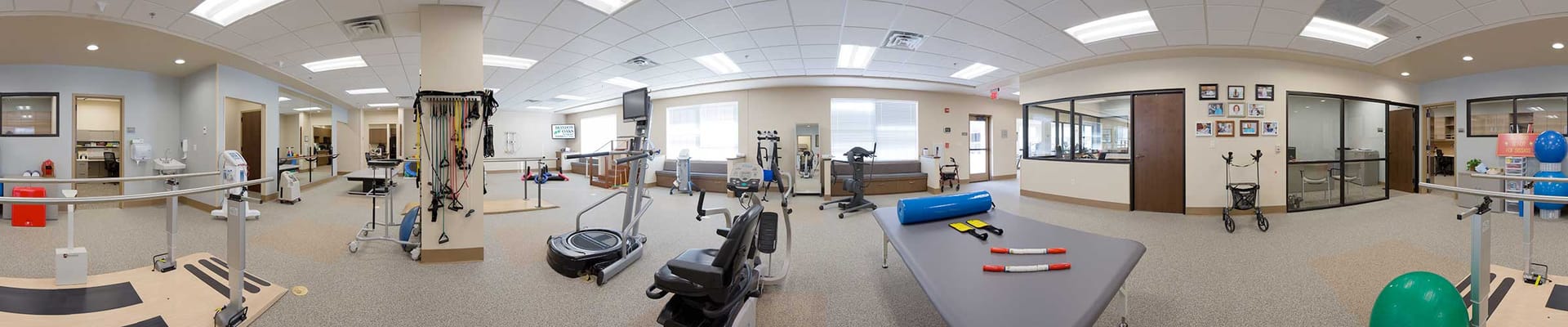 Interior view of a therapy room with exercise equipment