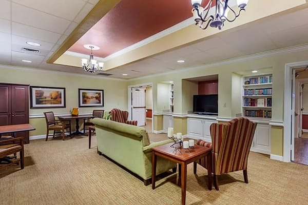 Cozy common area with seating and bookshelves