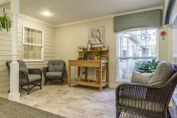 Bright common area with comfortable seating and decor