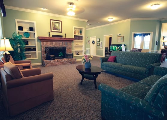 Comfortable common area with couches and fireplace