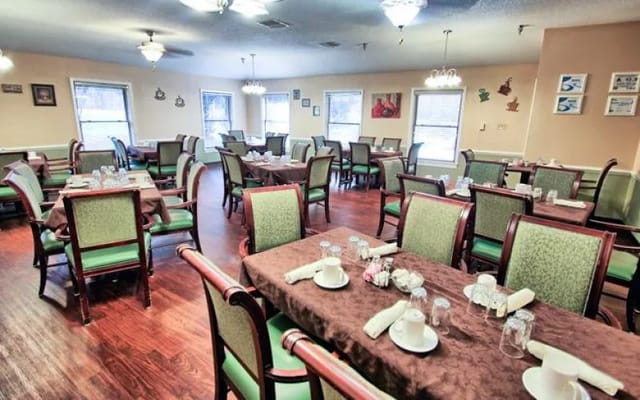 Dining room setup with tables and chairs