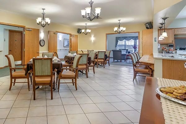 Dining area with tables and chairs in a well-lit room