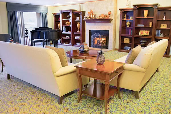 Cozy common area with seating and a piano