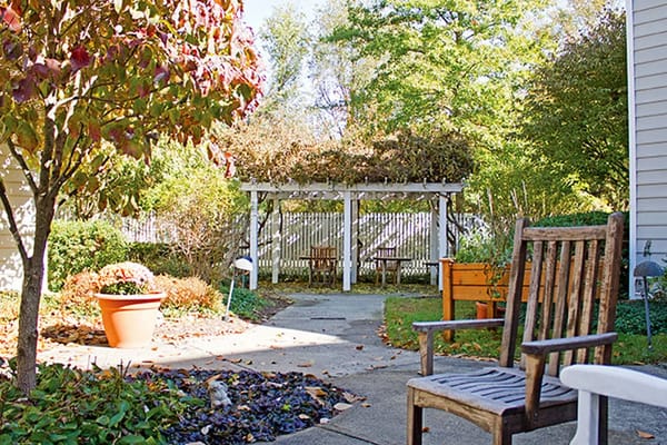 Outdoor seating area with garden and pergola