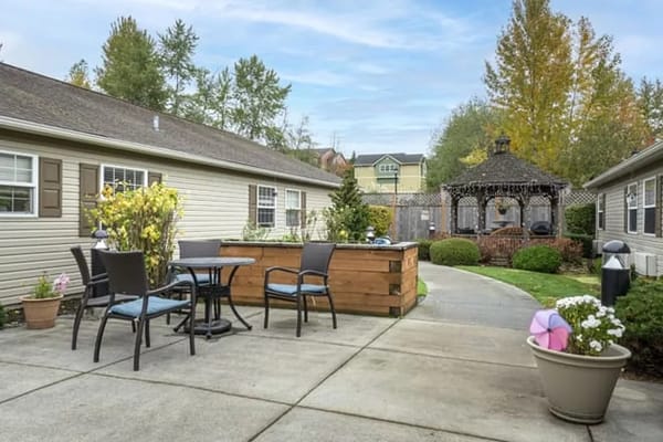 Outdoor seating area with gazebo and gardens