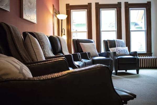 Cozy seating area with leather chairs and warm lighting