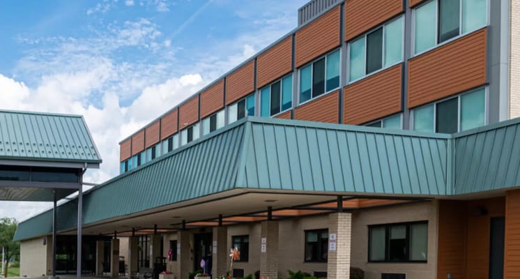 Exterior of Seacrest Rehabilitation and Nursing Center showcasing its architecture and entrance.