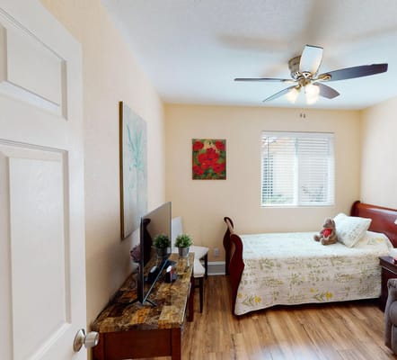 Cozy private resident room with a bed and TV