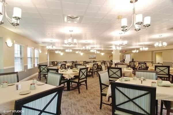 Bright dining room with tables set for meals