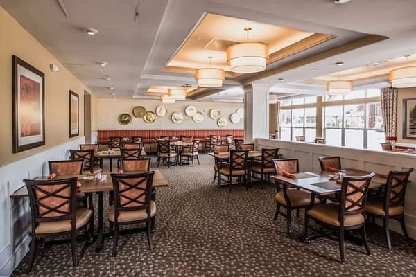 Bright dining area with tables and chairs
