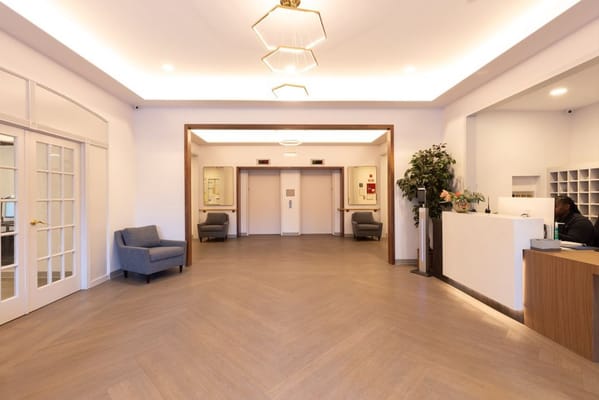 Bright lobby area with seating and reception desk
