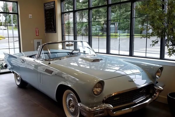 Classic car displayed in a facility lobby