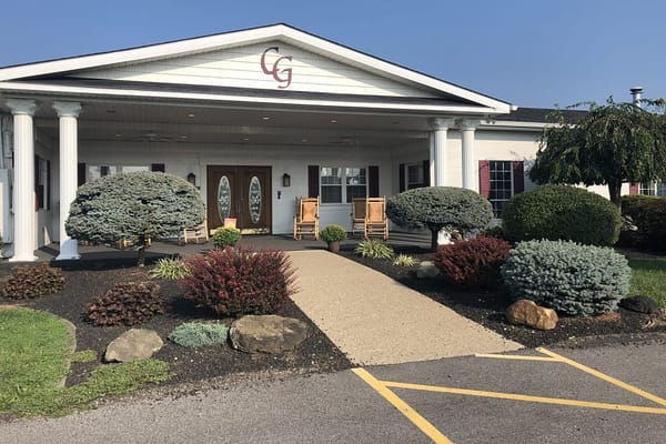 Exterior view of Cedar Grove Assisted Living with landscaped garden
