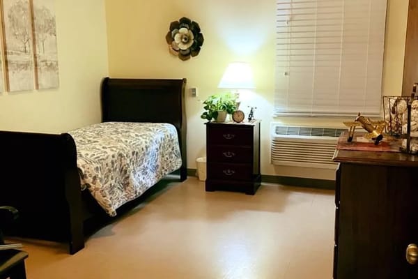 Cozy resident room with a bed and decor