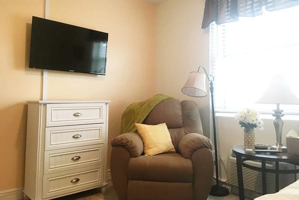Cozy resident room with furniture and a TV