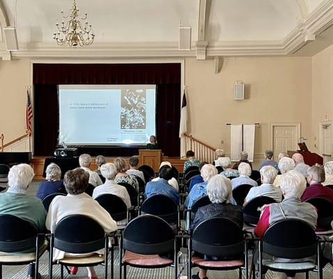 Seniors attending a lecture at Cedarfield