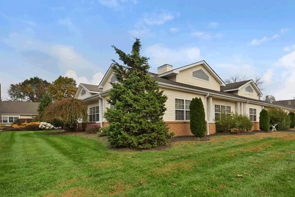 Exterior view of the facility with landscaped grounds