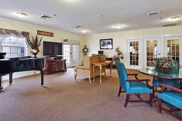 Interior common area with seating and a piano