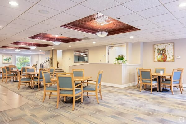 Bright dining room with tables and chairs