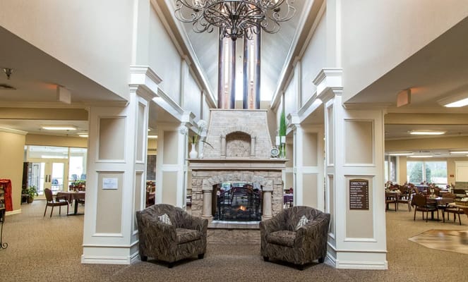 Interior common area with chairs and fireplace