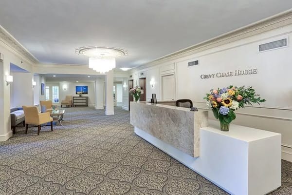 Bright lobby area of Chevy Chase House with flowers