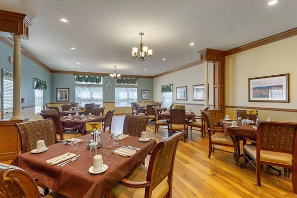 Bright dining room with tables set for meals