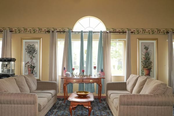 Living room with comfortable sofas and welcoming decor.