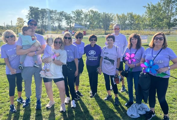 Group of smiling participants at an outdoor event