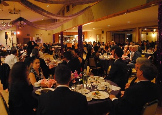 Residents enjoying a dining event in a festive setting