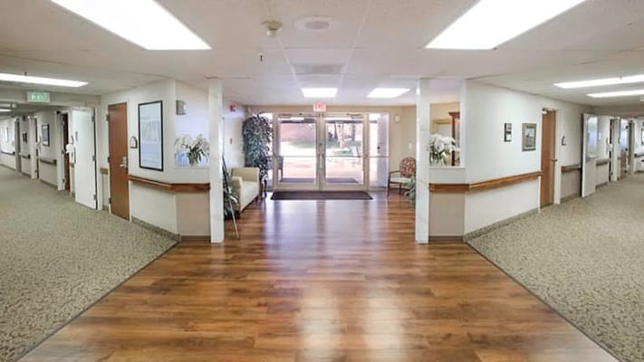 Bright interior hallway of a senior care facility