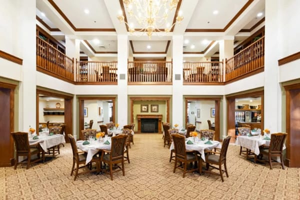 Spacious dining area with tables set for meals