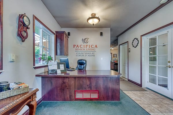 Lobby area with reception desk at senior living facility