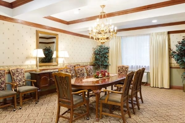 Cozy dining room with elegant furnishings and chandelier