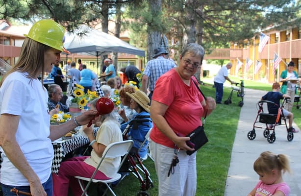 Residents enjoying a summer event with decorations and food.