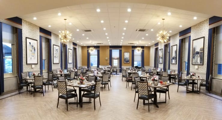 Dining room area with tables set for residents