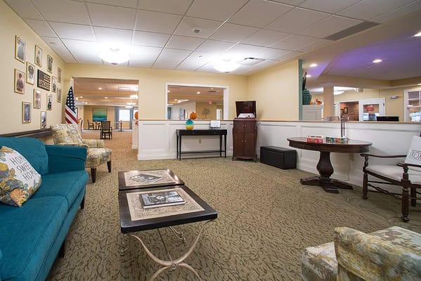 Cozy lounge area with seating and decor at Danbury Senior Living.