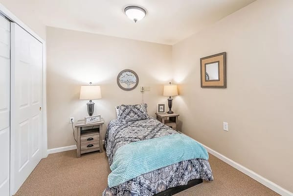 Bright and inviting bedroom with a bed and bedside tables