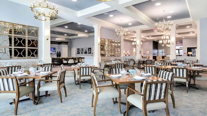 Elegant dining room with tables set for meals
