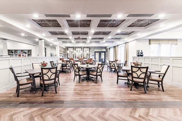 Bright dining area with tables and chairs