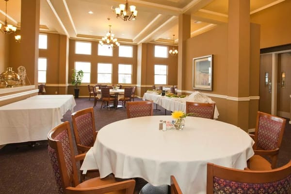 Dining room with tables set for residents