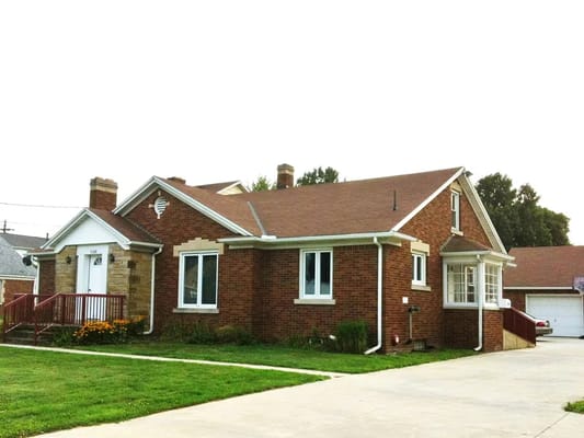 Exterior view of a brick nursing home building