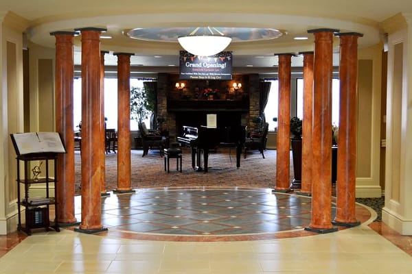 Interior view of the lobby with decorative columns and a piano