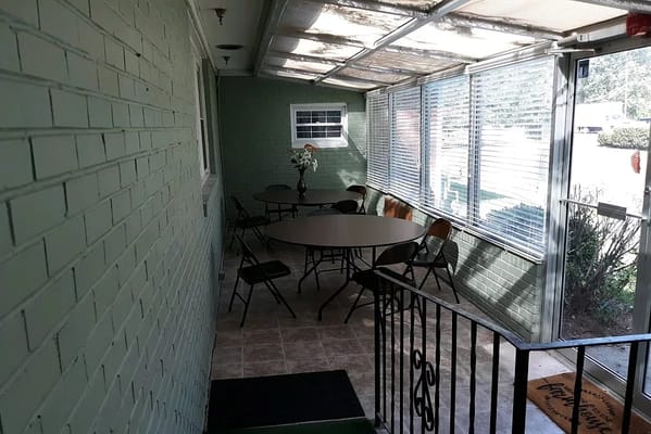 Outdoor seating area with tables and chairs