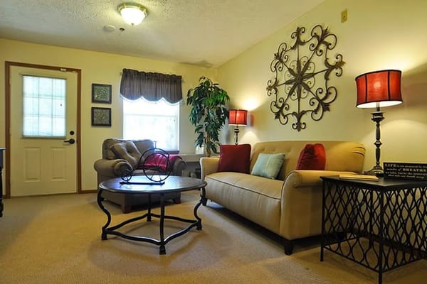 Living room with comfortable seating and decorative lamp