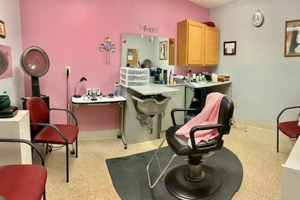 Interior of a hair salon with styling chair and tools