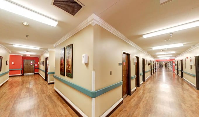 Hallway of a nursing facility with resident rooms