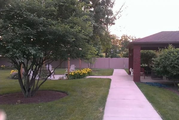 A serene garden area with walking paths and seating